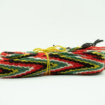 Sokkebånd til bunad fra Borre i fargene rødt, grønt, gult, svart og hvitt