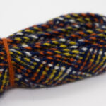 Sokkebånd til mannsbunad fra Romerike, med rutemønster i blått, hvitt, oransje og gult